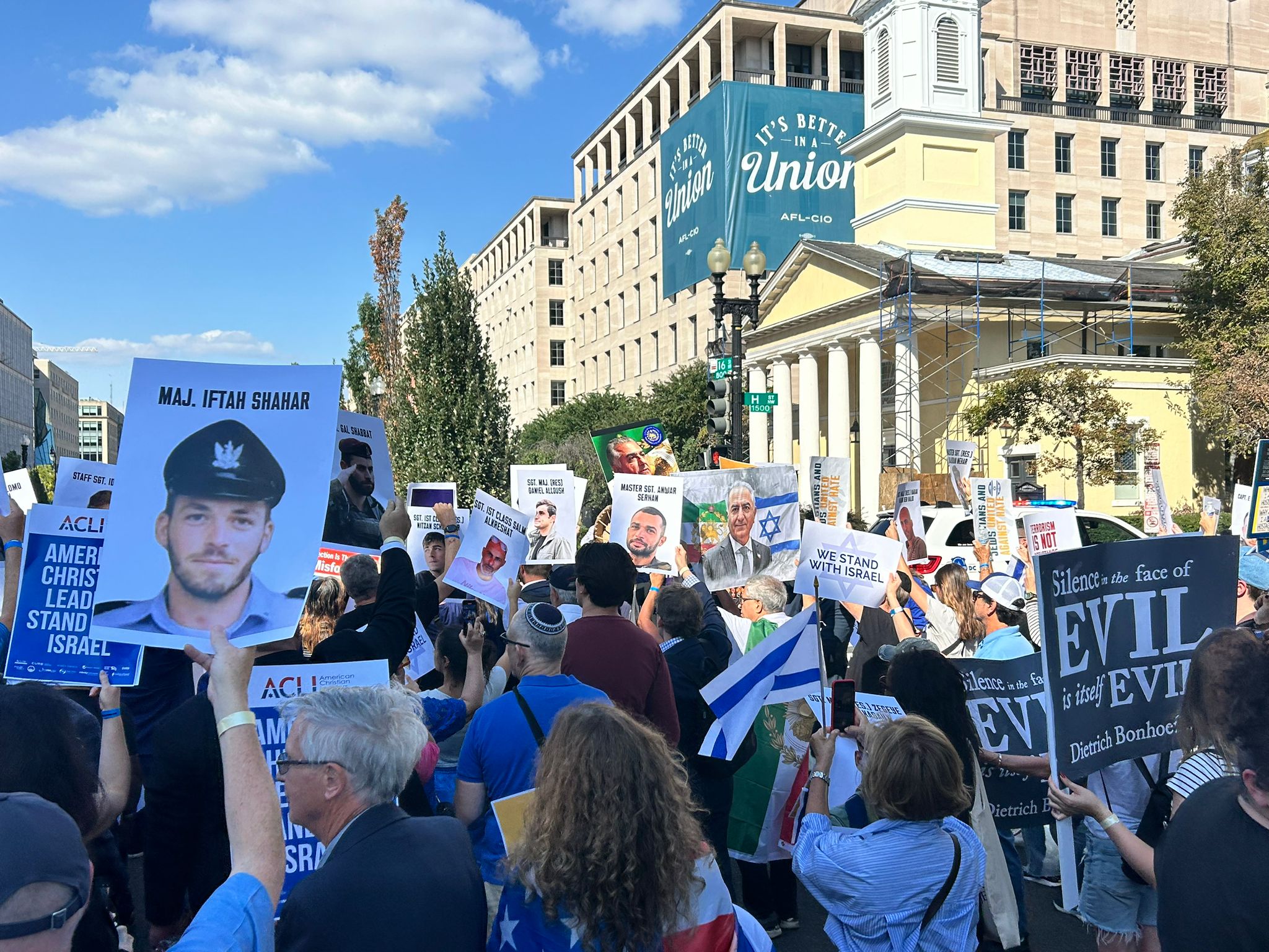 Group of people holding up signs
